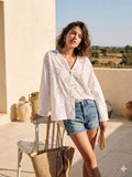 Blouse blanche ajourée en broderie anglaise