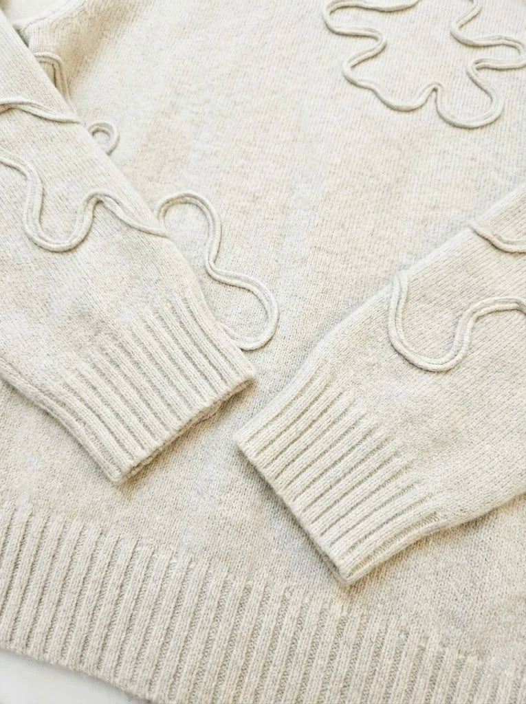 Pull en maille texturée à motifs abstraits