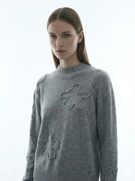 Pull en maille texturée à motifs abstraits